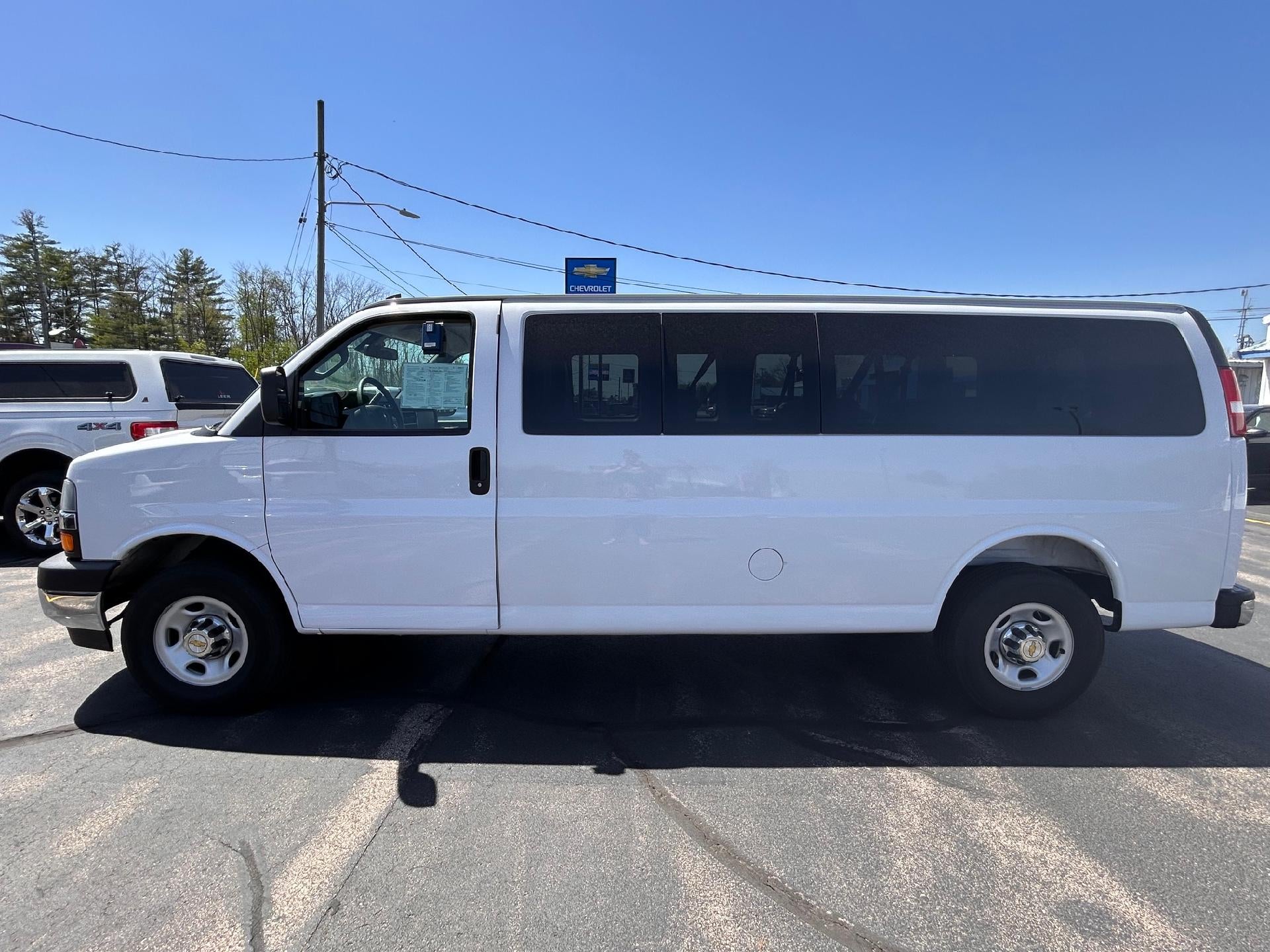 2025 Chevrolet Express Passenger 1LT in Summit White — front three-quarter view